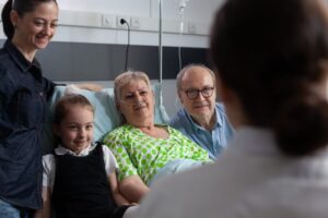 A hospital nurse works on improving patient outcomes with staff competency