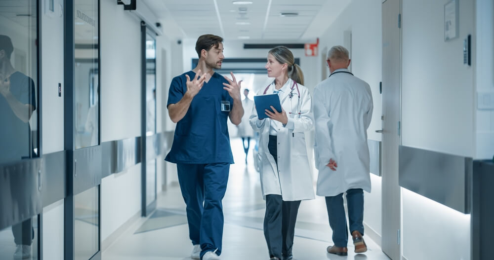 A healthcare team discusses nurse retention tools