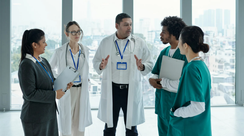 Health care leadership team discussing competency management automation