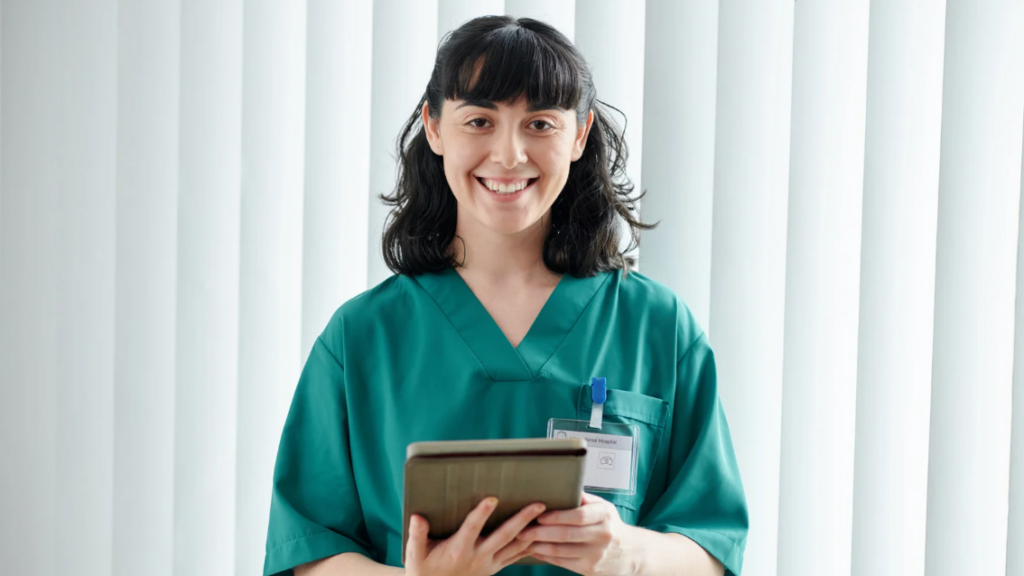 Nursing leader reviewing automated competency management dashboard used by health care leaders