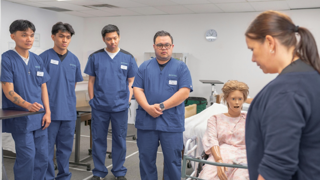 New Graduate Nurse in Scrubs Listening Attentively During Structured Clinical Orientation in a Hospital Skills Lab | Creative Health Care Insight