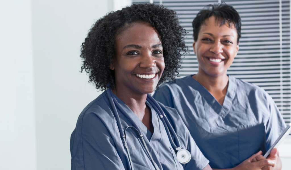 Nurse mentor and mentee meeting together in a hospital setting to support professional development, leadership growth, and Magnet Recognition success| CHCI