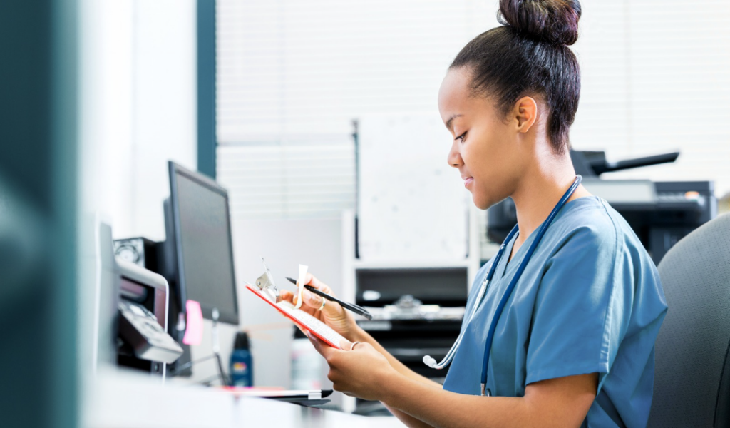 Healthcare leader reviewing nurse competency and professional development data on a digital platform | CHCI