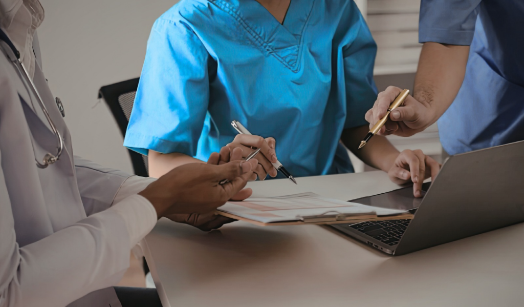 Healthcare leaders reviewing workforce data and discussing strategies to reduce nurse burnout and improve retention | CHCI