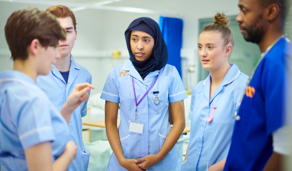 Experienced nurse preceptor supporting a new graduate nurse during orientation | Creative Health Care Insight