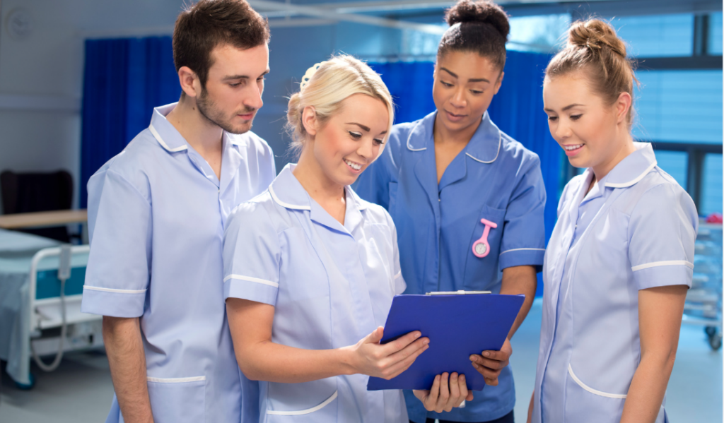Nurse mentor discussing professional development opportunities with a new graduate nurse | Creative Health Care Insight