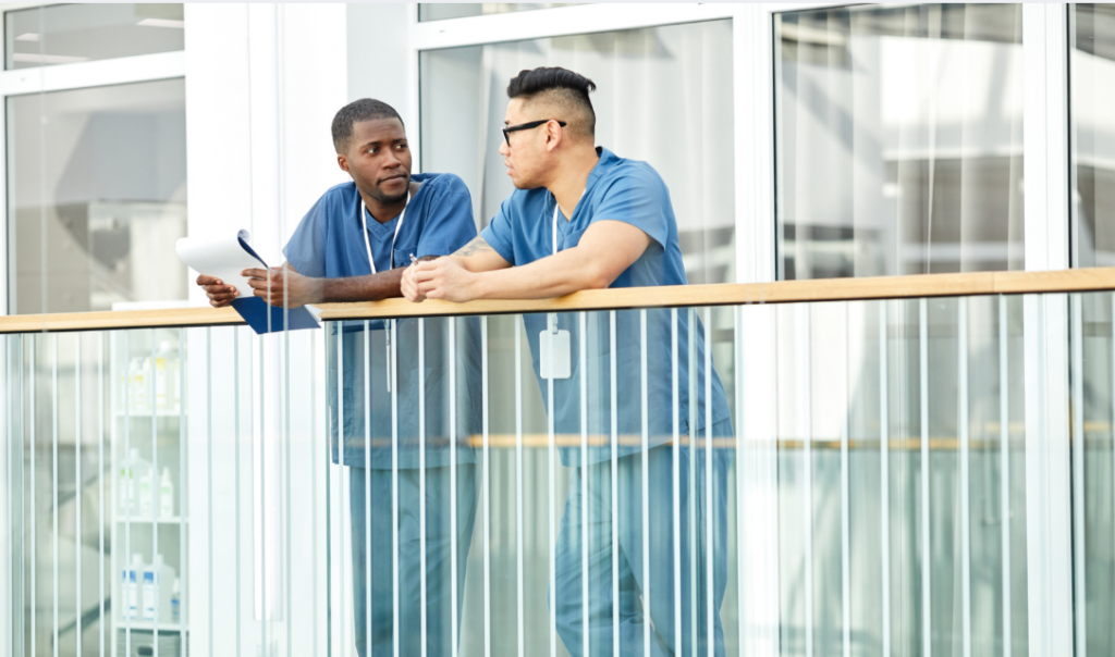 Nurse mentor and mentee discussing professional development and retention goals | Creative Health Care Insight