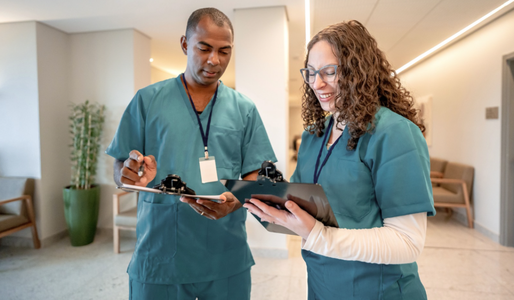 Healthcare preceptor and orientee discussing feedback and competency progress together | Creative Health Care Insight