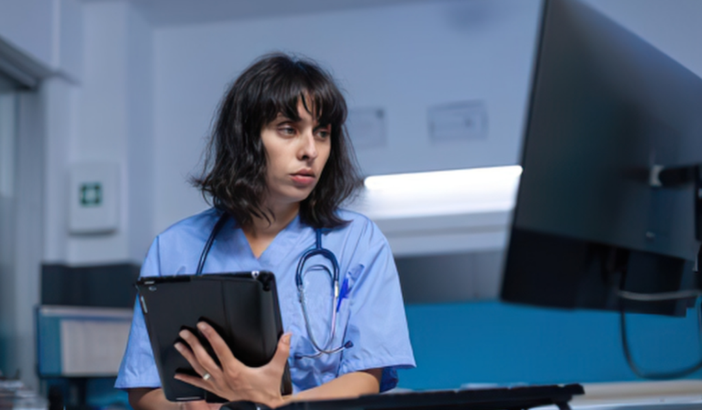 Healthcare leader reviewing workforce data to identify professional development gaps | Creative Health Care Insight