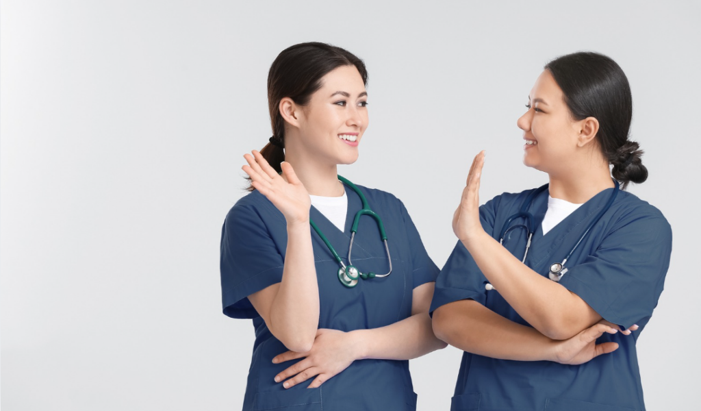 Healthcare professionals participating in a peer feedback discussion | Creative Health Care Insight