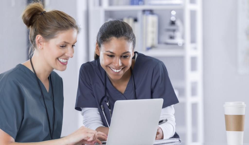 Clinical educator reviewing orientation progress and competency documentation with a preceptor | Creative Health Care Insight