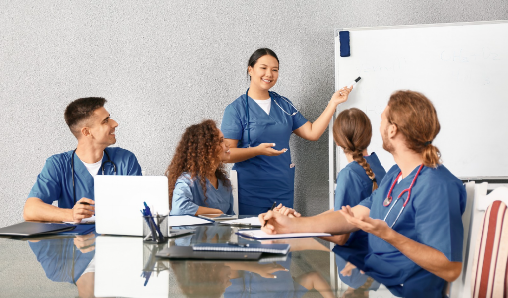 Nurse Educator Leading a Small Group Discussion on Professional Development | Creative Health Care Insight
