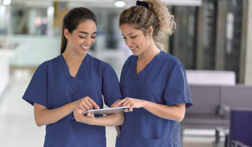 Preceptor and preceptee reviewing clinical orientation progress together during a nursing shift | Creative Health Care Insight