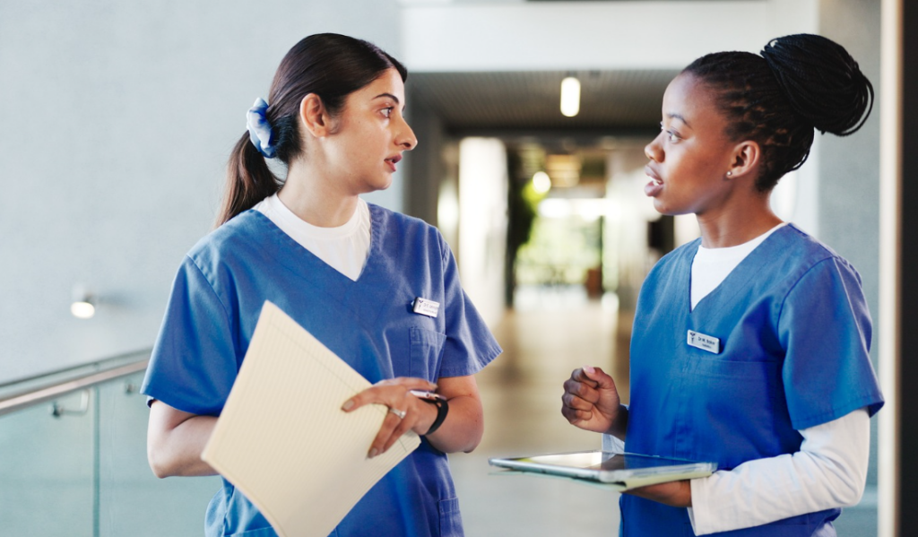 Nurse mentor and emerging nurse leader reviewing a professional development plan | Creative Health Care Insight